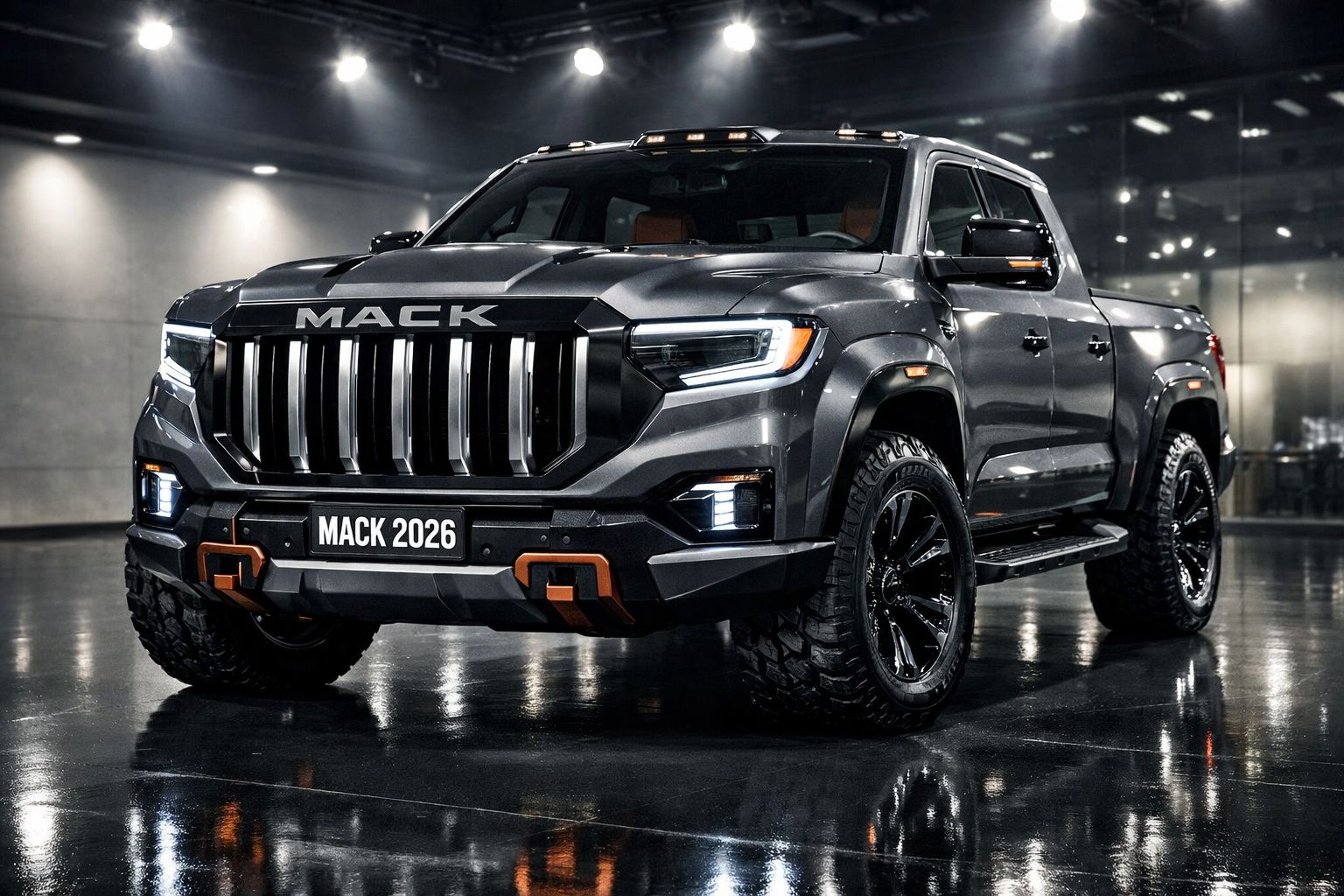 Picape preta robusta Mack 2026 com pneus grandes, em ambiente interno iluminado e chão refletor.